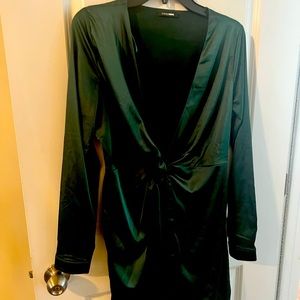 Sexy short emerald green satin dress. Plunging deep V neckline.